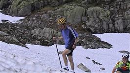 Michael and Gavin walk back up the snow slope after their slides at Halvfjerdingsvatnet